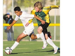 Aden Bowman's Levi Elliot, right, attempts to get the ball from Walter Murray's Johann Jacob in high school soccer action at Kinsmen Field at the SaskTel Sports Centre on Monday.