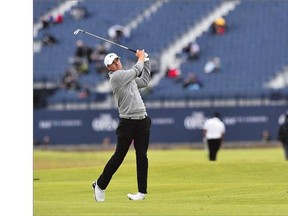 American phenom Jordan Spieth hits an approach during Monday's practice round at the Old Course in St. Andrews, Scotland. Spieth is the most intriguing player in this year's British Open after winning both the Masters and U.S. Open titles. He has a shot to become only the second player in history to win the first three majors of the year. Ben Hogan accomplished the feat in 1953. See Cam Cole's column about U.S. Open runner-up Dustin Johnson on B3.