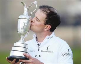 American Zach Johnson plants a kiss on the Claret Jug after winning the British Open in a four-hole playoff at the Old Course in St. Andrews, Scotland on Monday.