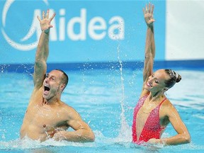 Americans Bill May, left, and Christina Jones, right, won the technical synchronized swimming mixed duet event at the Swimming World Championships Sunday.