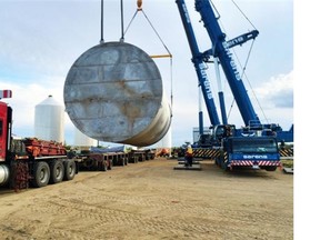 An amine storage tank manufactured by AGI-Envirotank is loaded on a specialized trailer for its four day journey to southwest Saskatchewan, where it will be used in SaskPower’s Boundary Dam carbon capture facility. Photo courtesy of AGI Envirotank.