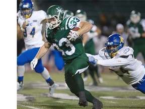 Andre Lalonde of the University of Saskatchewan Huskies outruns a shirt tail tackle attempt by Terrell Davis of the UBC Thunderbirds in CIS football action at Griffiths Stadium in Saskatoon, Friday.