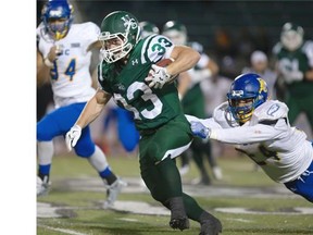 Andre Lalonde of the University of Saskatchewan Huskies outruns a shirt tail tackle attempt by Terrell Davis of the UBC Thunderbirds in CIS football action at Griffiths Stadium in Saskatoon, Friday, Oct. 23, 2015..