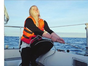 Annika Holm Nielsen sails in the Oresund strait between Copenhagen and Malmo, Sweden. The 24-year-old Danish woman sails refugees across the windy straits to safety in Sweden.