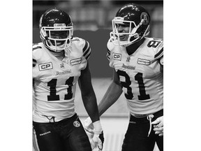 Argonauts' Natey Adjei, left, celebrates his touchdown with Tori Gurley against the B.C. Lions during Toronto's comeback victory in Vancouver during Week 5 of the CFL season.