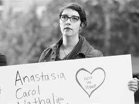 Ariel Troster's sign says it all: About 300 people came out for the Take Back the Night rally in downtown Ottawa on Thursday. The women's names on her poster were all killed Monday.