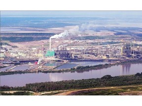 The Athabasca River near the town of Fort McMurray, Alta. A new study has found the river level has fluctuated much more widely than the last 62 years of records suggest. Greenpeace is calling for an end to oilsands mining in the region.
