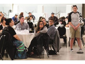 Attendees at the Federation of Saskatchewan Indian Nations' Youth Legislative Assembly at TCU Place pose questions to candidates Wednesday.