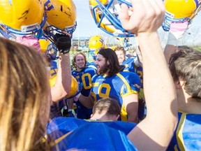Saskatoon Hilltops offensive linemen Terry Thesen speaks with his team about beer pong after his team defeats the Winnipeg Rifles in PFC semifinal playoff action at SMF Field on Sunday, October 18th, 2015.