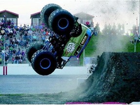 Bill Payne does a backflip in his monster truck at Bridge City Auto Speedway on Friday.