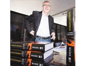 Bill Waiser with his book Saskatchewan: A New History at the Word on the Street Festival in Saskatoon in 2012.