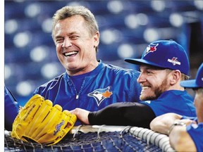 Blue Jays manager John Gibbons, left, and third baseman Josh Donaldson share a happy moment during an optional practice ahead of Game 5.