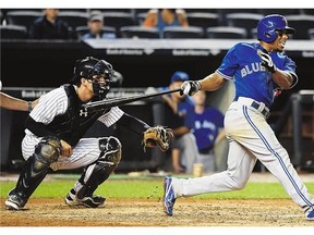 Blue Jays' Ben Revere hits a single against the Yankees Saturday. There have been about 12,000 empty seats per game in Yankee Stadium as the Yankees chase a playoff spot.