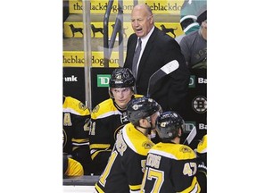 Boston Bruins head coach Claude Julien tries to rally his players in early NHL action. With the Bruins off to an 0-3-0 start, Julien's job appears to be in jeopardy.