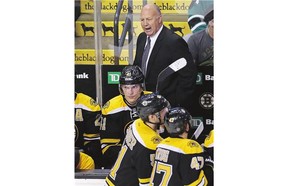 Boston Bruins head coach Claude Julien tries to rally his players in early NHL action. With the Bruins off to an 0-3-0 start, Julien's job appears to be in jeopardy.