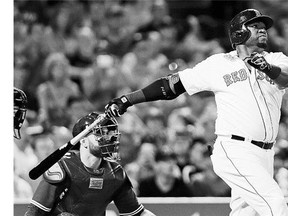Boston Red Sox designated hitter David Ortiz watches his 498th career home run go over the wall at Fenway Park in MLB action Wednesday night against the Toronto Blue Jays.