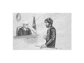 Boston Marathon bomber Dzhokhar Tsarnaev, right, stands before U.S. District Judge George O'Toole Jr. as he addresses the court during his sentencing, Wednesday in federal court in Boston. Tsarnaev apologized to the victims and their loved ones for the first time just before the judge formally sentenced him to death.