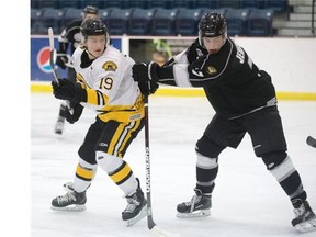 Braden Oleksyn of the Estevan Bruins, left, in action during SJHL showcase event at the Legends Arena in Warman on Monday.