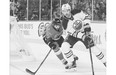 Brandon Bollig, left, of the Calgary Flames chases Justin Schultz of the Edmonton Oilers during a pre-season NHL game at Scotiabank Saddledome earlier this week.