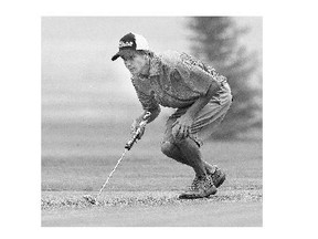 Brett Henry lines up a putt during the Central Amateur golf tournament at the Saskatoon Golf and Country Club on Monday in Saskatoon.