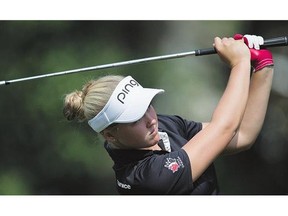 Brooke Henderson of Smiths Falls, Ont., hits her second shot on the eighth hole during final-round action Sunday at the Canadian Pacific Women's Open in Coquitlam, B.C.