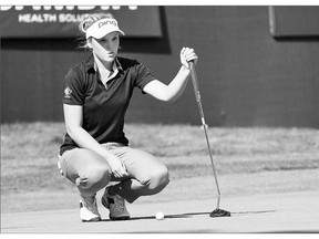 Brooke Henderson, 17, of Smiths Falls, Ont., lines up a putt during final-round action at the LPGA's Cambia Portland Classic on Sunday in Portland, Ore. Henderson won the tournament by eight strokes.