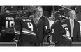 Buffalo Sabres head coach Dan Bylsma, centre, sees two challenges - bringing the players together as a team and restoring a winning mindset after two devastating seasons.