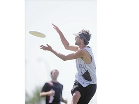 Bunny Thugs player Brock Storey grabs a pass for a point against the Rogue Hippos during Saskatoon's Annual Ultimate Frisbee Tournament at Forest Park Fields on Saturday