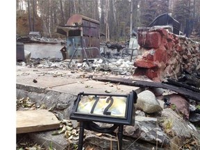 A burned out cabin is shown at Waden Bay, 380 kms North of Saskatoon, on Saturday.