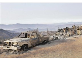 A burned truck and remains of a property are shown near Clearlake, Calif. on Wednesday as thousands of firefighters work in 24-hour shifts to battle the Northern California wildfire. The fire, 180 kilometres north of San Francisco, is the largest of 23 fires statewide and is being fought by about a third of the 10,000 firefighters dispatched in the state. At least 39 homes have now been destroyed and 275 square kilometres of land has been charred by the blaze.