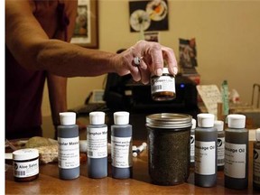 A variety of the cannabis oil available to customers is shown at the Cannabis Buyers Club, in Victoria, B.C., on June 11, 2015. Canadians who have been prescribed medical marijuana could one day see their insurance company footing the bill, experts predict, following the introduction of new Health Canada rules that allow for the sale of cannabis oils. THE CANADIAN PRESS/Chad Hipolito