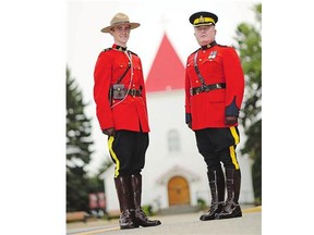 Cadet Andrew Michael Wood, left, with his father Insp. Robert Michael Wood at RMCP Depot Division in Regina Friday, will graduate today to become a fourth generation RCMP officer.