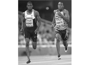 Canada's Brendon Rodney, left, and Jamaica's Julian Forte compete in a men's 200 metres heat at the world track and field championships in Beijing on Tuesday.