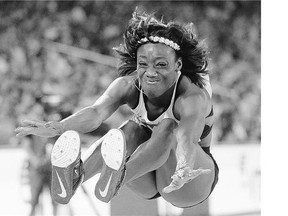 Canada's Christabel Nettey fell just short of the podium in the women's long jump at the world championships at the Bird's Nest stadium in Beijing Friday.