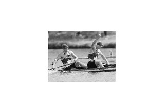 Canada's Gabriel Beauchesne-Sevigny, left, and Benjamin Russell celebrate their gold medal victory in the C2 1000m final canoe race at the 2015 Pan Am Games in Welland, Ont.