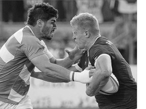 Canada's John Moonlight, right, takes on Argentina's German Schulz during Canada's rugby sevens gold medal victory at the Pan Am Games. Moonlight is one of five Pan Am champs suiting up for Canada at the Pacific Nations Cup.