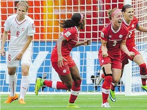 Canada's Josee Belanger celebrates after scoring during a 2015 Women's World Cup match. The Quebec player hopes to inspire young girls in her home province.