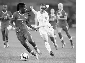Canada's Kadeisha Buchanan, centre left, shows her skills at the FIFA World Cup tournament. She is on the shortlist for the world's women's soccer player of the year award.