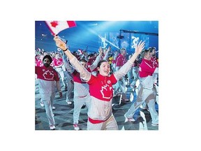 Canadian athletes march in the parade of nations