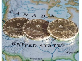 The Canadian dollar hit fresh multi-year lows below the 80-cent US level Thursday against an American currency that strengthened on growing conviction the U.S. Federal Reserve will move to hike rates sooner rather than later.