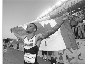 Canadian sprinter Andre De Grasse celebrates after winning the men's 100-metre final at the Pan Am Games Wednesday at York University in Toronto. The 20-year-old finished in 10.05, less than a tenth of a second shy of his semifinal time.