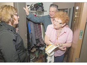 NDP candidate Sheri Benson, left, speaks with Walter and Muriel Stangby while she campaigns downtown.