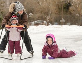 Catherine Gingras had her hands full helping her daughters two-year-old Rose and four-year-old Jeanne (falling in photo) stay on their skates while on an outing at the Meewasin Rink on Spadina Crescent, January 15, 2015. The Gringrases were in town from Montreal. Despite a few tumbles, the children were full of smiles.