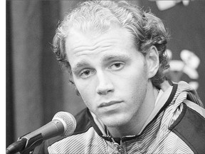 Chicago Blackhawks' Patrick Kane listens during a media availability on the first day of training camp Thursday. The Blackhawks' star is attending camp despite being the subject of a grand jury investigation of an alleged sexual assault.