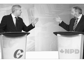 Conservative Leader Stephen Harper exchanges words with NDP Leader Tom Mulcair about the face-covering niqab during the French-language federal leaders' debate on Thursday.