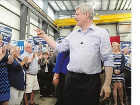 Conservative Leader Stephen Harper greets supporters in Sarnia, Ont., recently. A new survey has found the Conservatives are running first in Ontario, with the support of 38 per cent of voters who have made up their mind or are leaning toward one party.