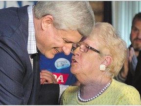 Conservative leader Stephen Harper listens to a supporter during a campaign stop Monday in Kingston, Ont. In the opening rounds of the long campaign, Harper has looked and sounded relaxed, forceful and confident.