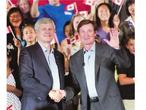 Conservative Leader Stephen Harper shakes hands with Wayne Gretzky during a campaign event in Toronto on Sept. 18, where Gretzky officially endorsed Harper's Conservatives.
