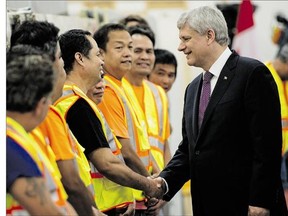Conservative Leader Stephen Harper, shown Tuesday touring a ceramic tile distributor in Toronto, promises to introduce a new, permanent home-renovation tax credit if re-elected.