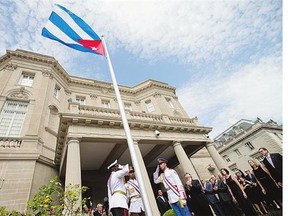 The Cuban flag was raised over the country's new embassy in Washington, Monday, after full diplomatic relations with the United States were restored.